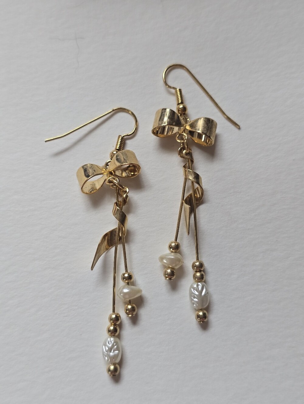 Gold Bow Drop Earrings with Pearl Accents